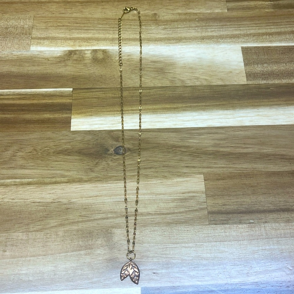 gold necklace with leaf pair charm
